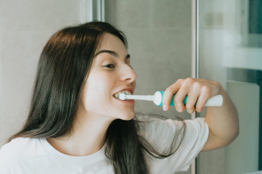 Woman brushing her teeth