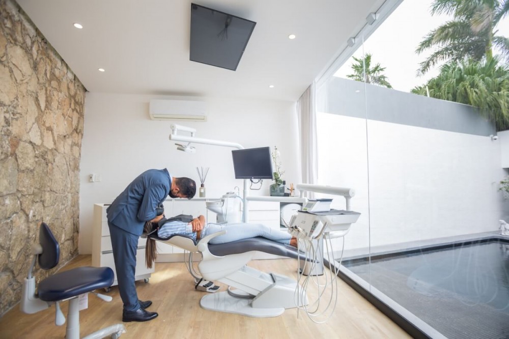 A dentist working on a patient